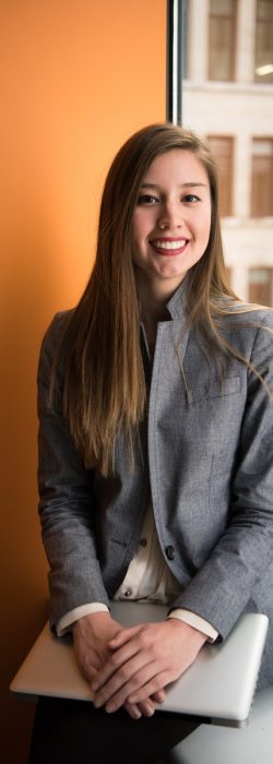 shallow focus photo of woman in gray jacket